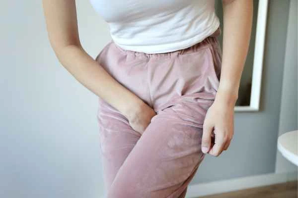 woman running for the toilet because of urinary incontinence Kingston Hill
